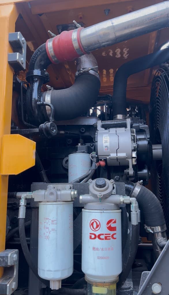 XCMG engine bay maintenance with alternator and filtration system